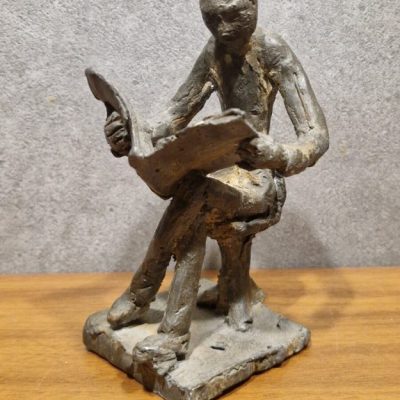 Figurative Sculpture Tin Reader